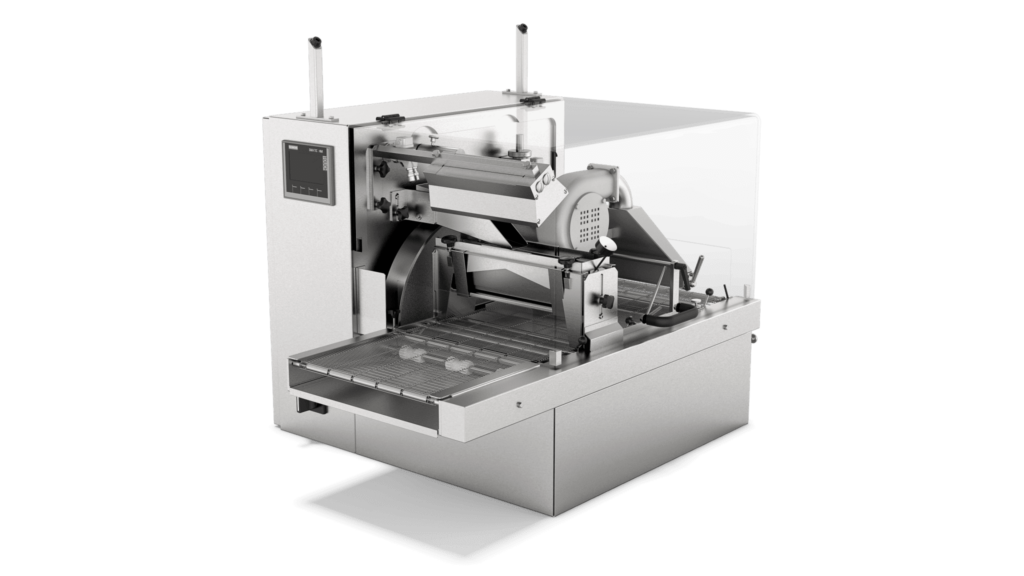 Aasted BabyFlex Enrober, compact and versatile enrobing solution designed for precise and efficient chocolate coating of smaller confectionery products.